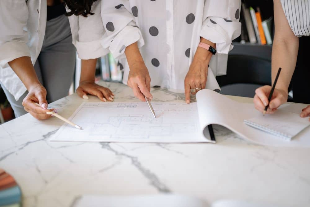 people discussing the scope of the work to accurately calculate construction cost