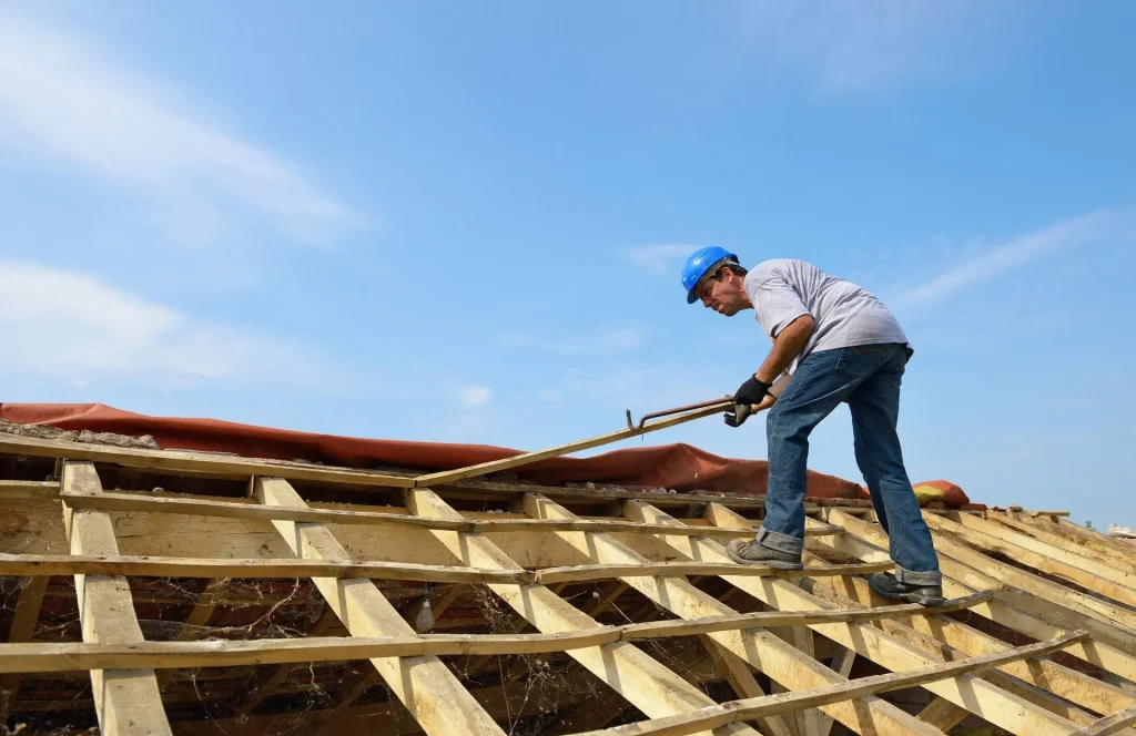 construction worker performing roof framing on a residential building by bb-builders pro