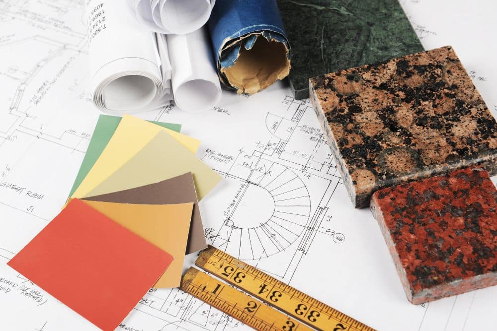 basement remodeling plan under sample materials and rolls of documents