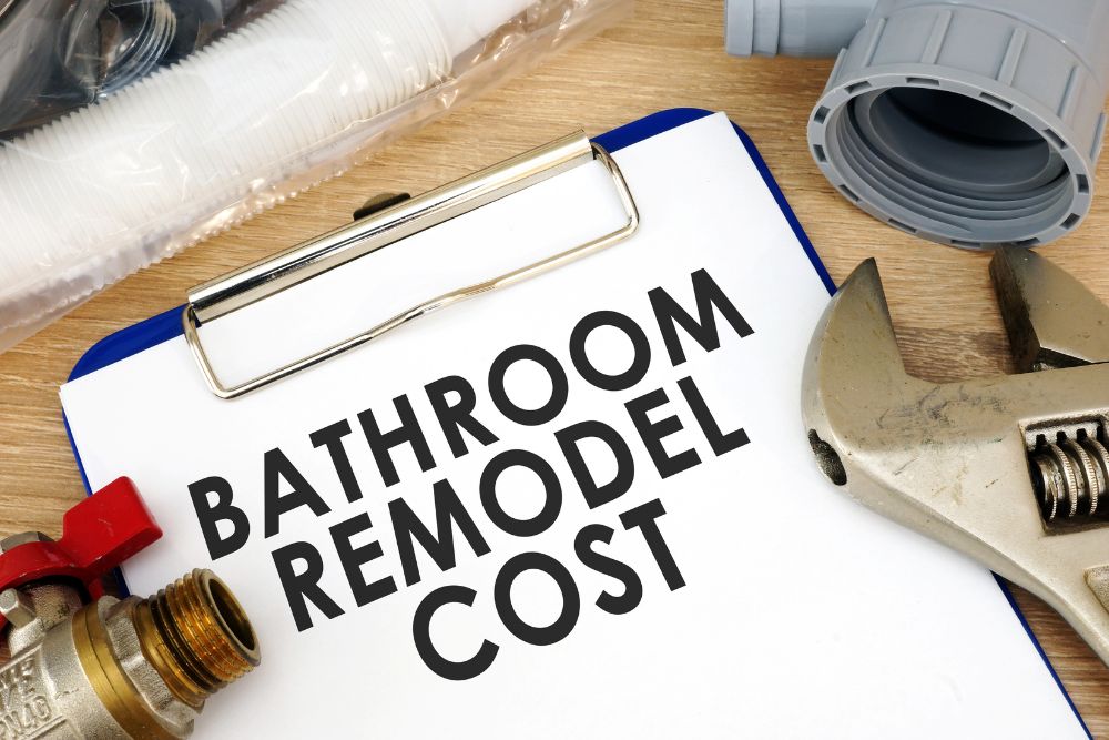 blue clipboard with paper that says bathroom remodel cost