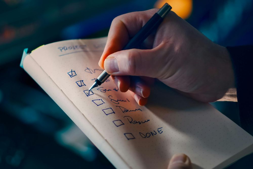 person ticking a bathroom remodel checklist