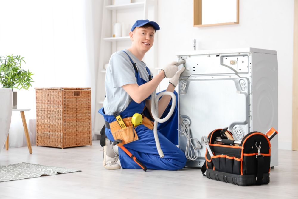man working on a bathroom fixture