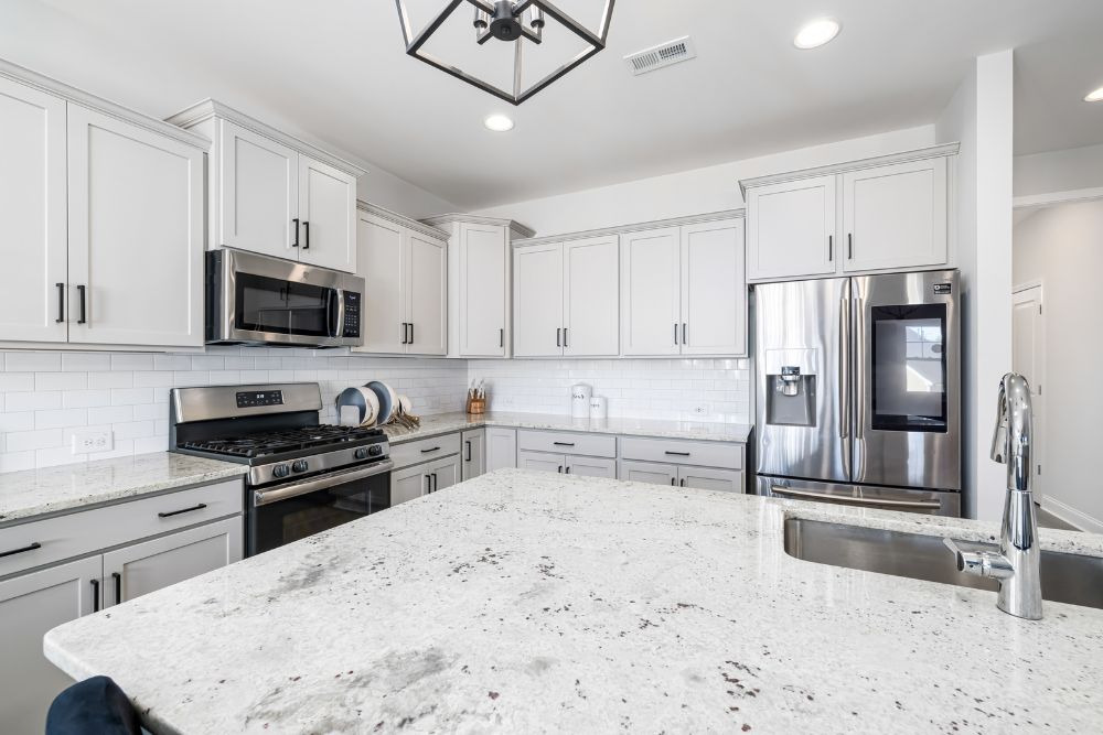 white u shaped kitchen with island