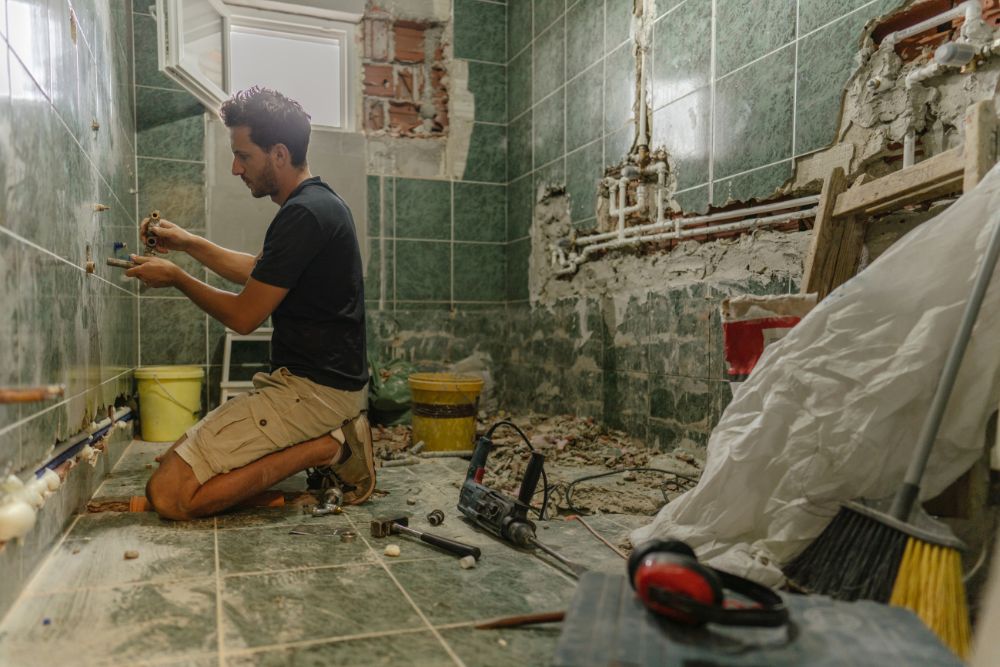 man renovating a bathroom