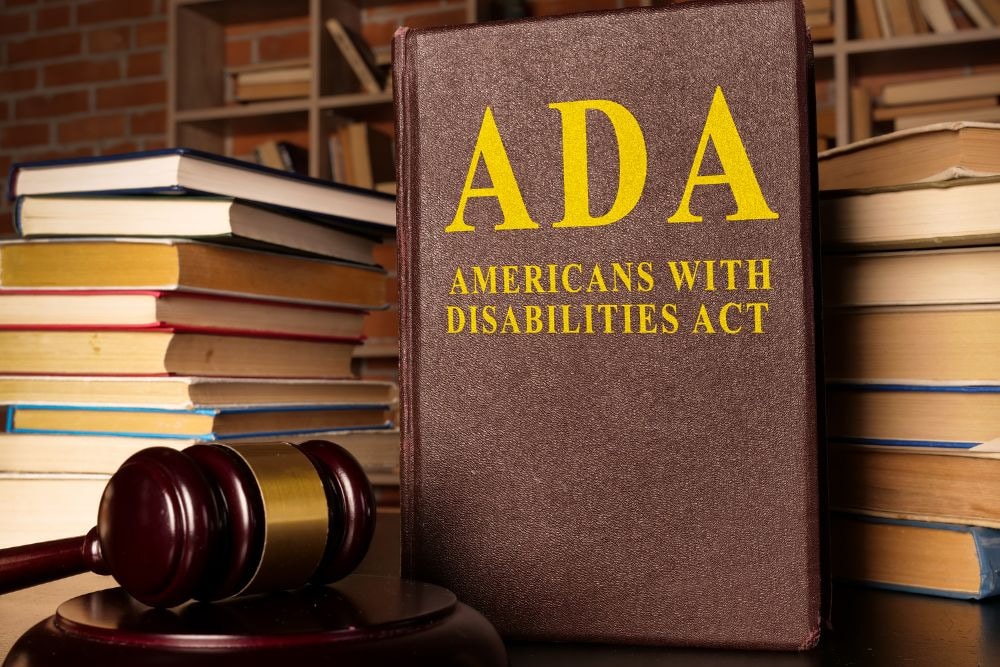 hardbound print of the americans with disabilities act (ada) next to a gavel