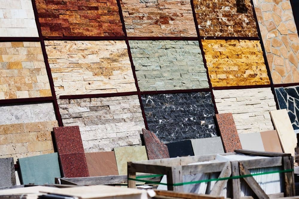 a collection of sample tiles on display, a common material used to finish seattle bathroom surfaces.