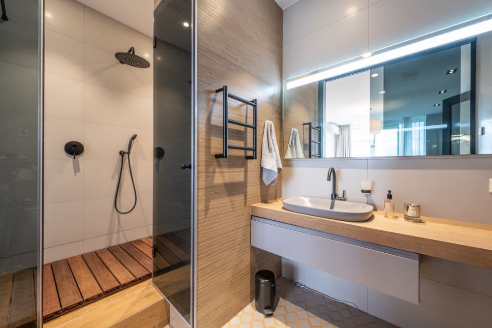 a hollywood bathroom with a compartmentalized shower area, showcasing the primary difference between the hollywood bathroom, vs jack and jill bathroom.