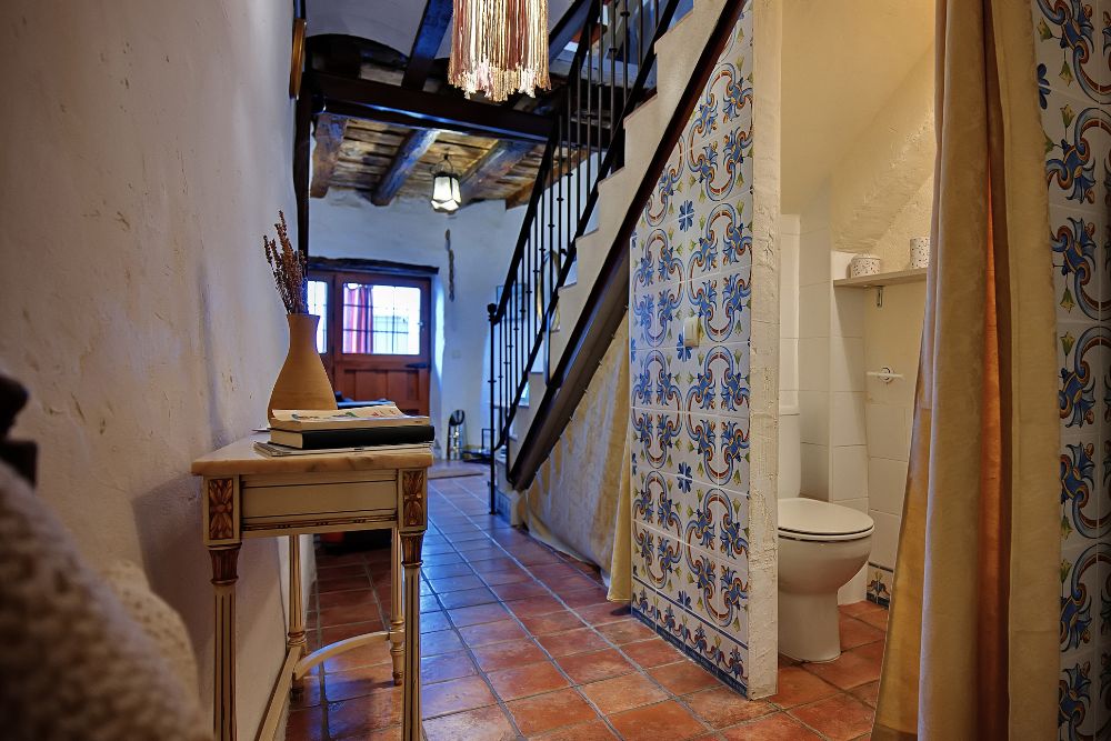 a half bath tucked under the stairs, one of the best locations for a new bathroom addition