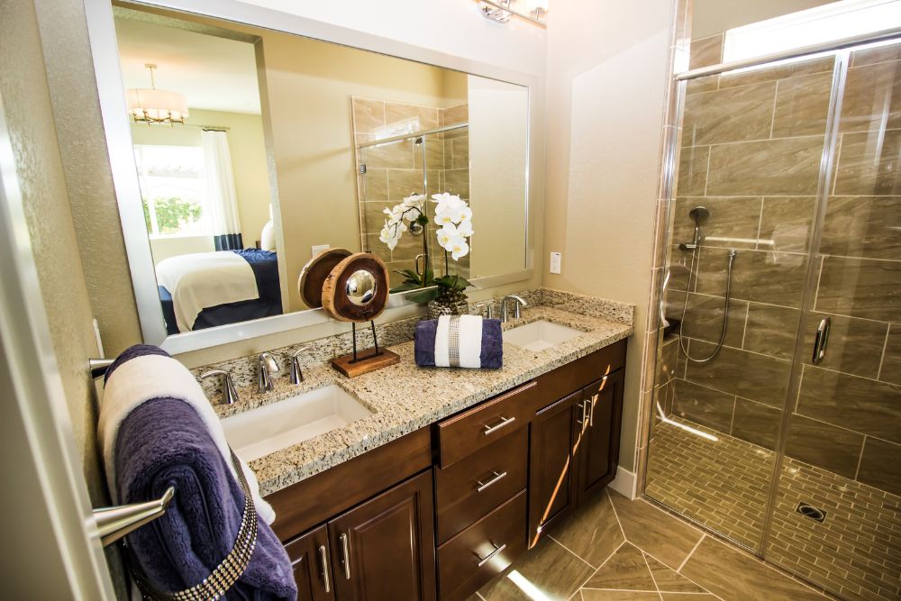 a custom vanity made of water-resistant hardwood, a popular choice of material for custom bathroom vanity storage.