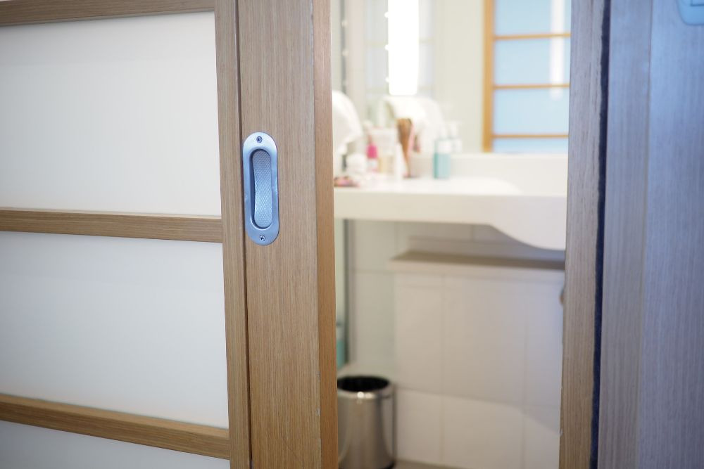 a sliding pocket door opening to the vanity area, one of the most popular improvements to the hollywood bathroom layout