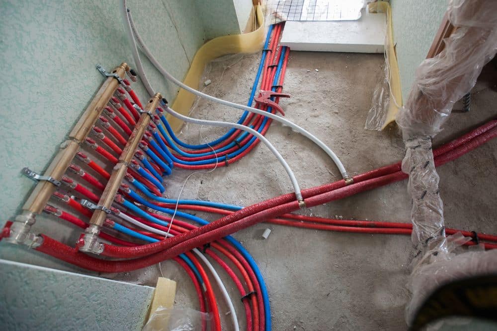 conduits supplying power to the electric floor heating mat.