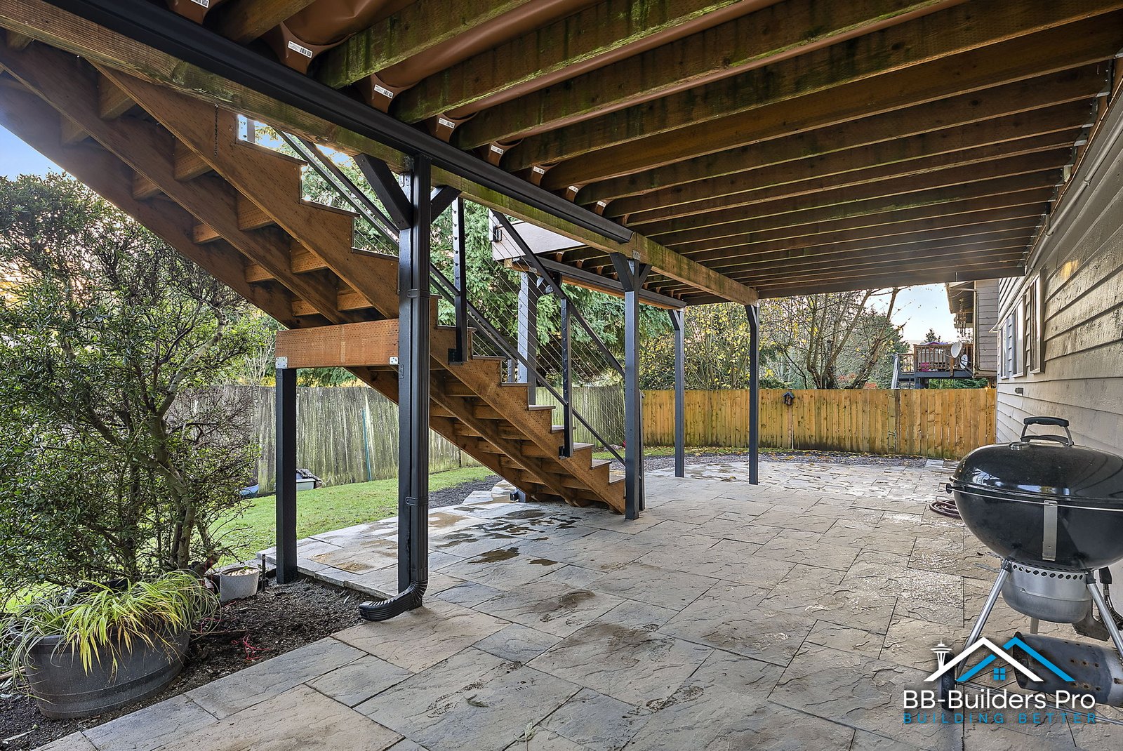 under-deck framing, posts and stairs of a raised deck, deck repair vs replacement in the seattle area