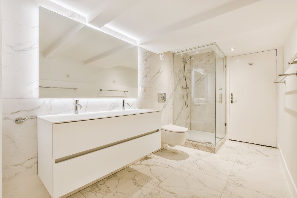 smart mirror with backlights and interactive touch-screen controls, dominating a white floating vanity