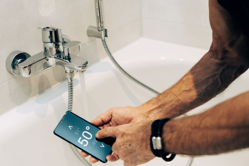 smart shower with temperature controls and pre-heating done with an app.