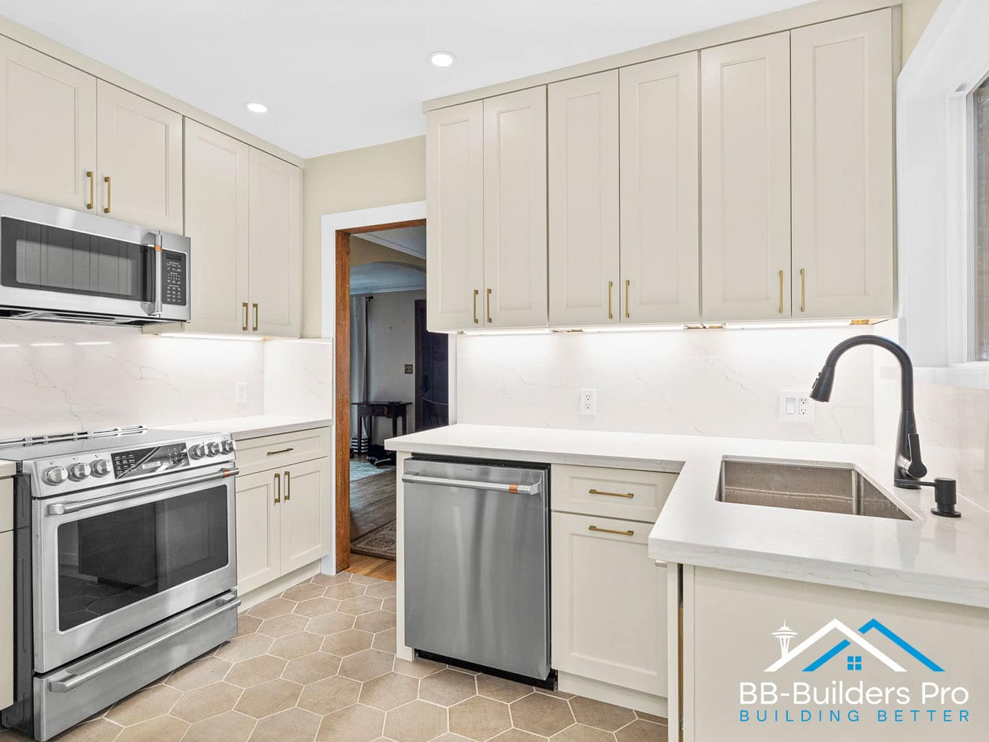 remodeled kitchen with quartz counters, undercabinet lighting, and new outlets by bb-builders pro
