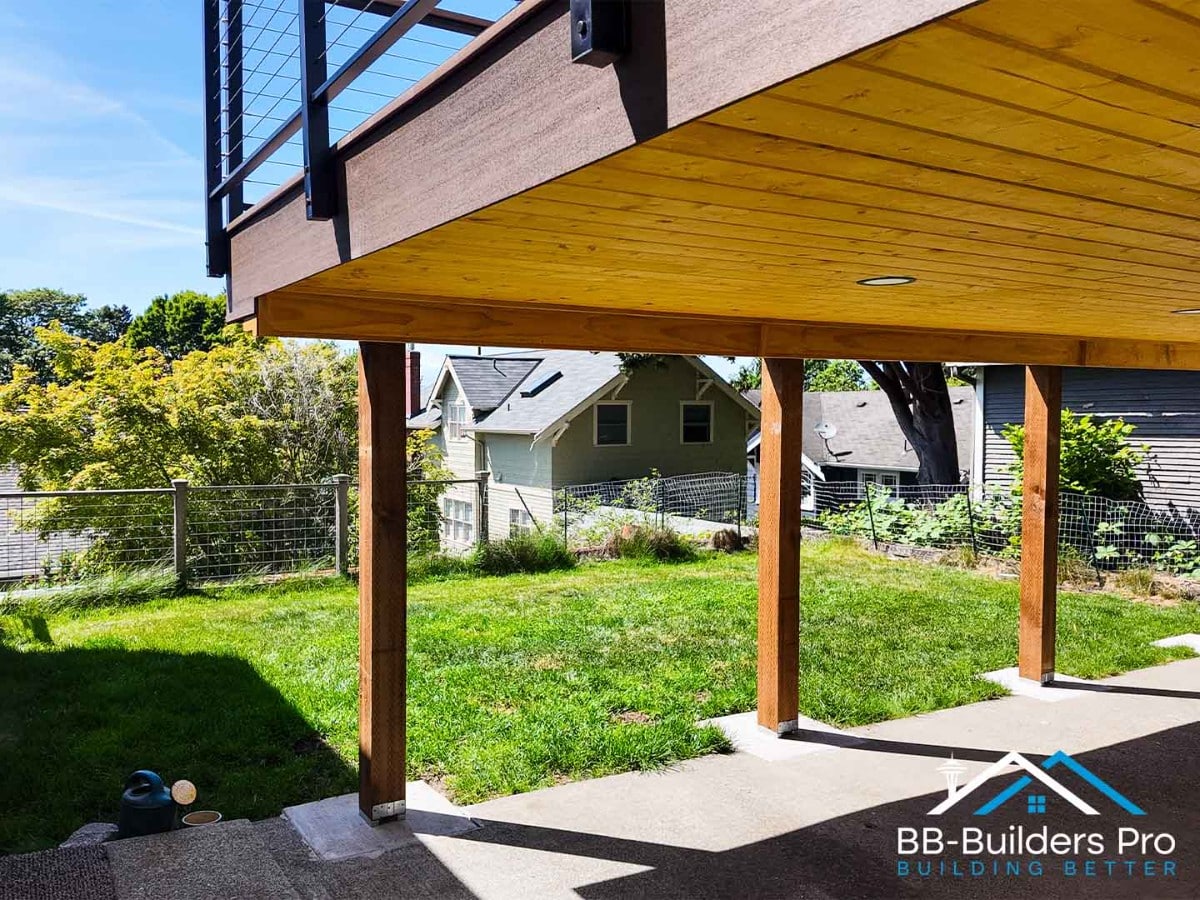 cedar posts, beams and a finished ceiling on a covered patio in the seattle area