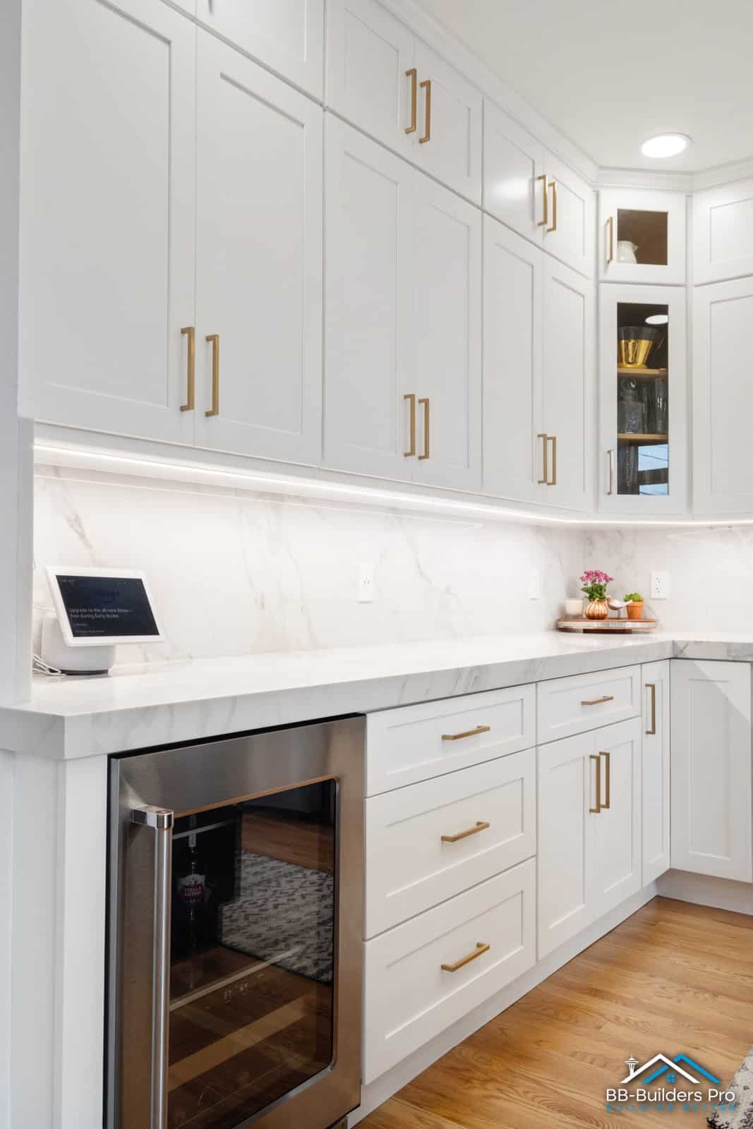 marble-look slab backsplash with under-cabinet lighting in a seattle-area kitchen by bb-builders pro