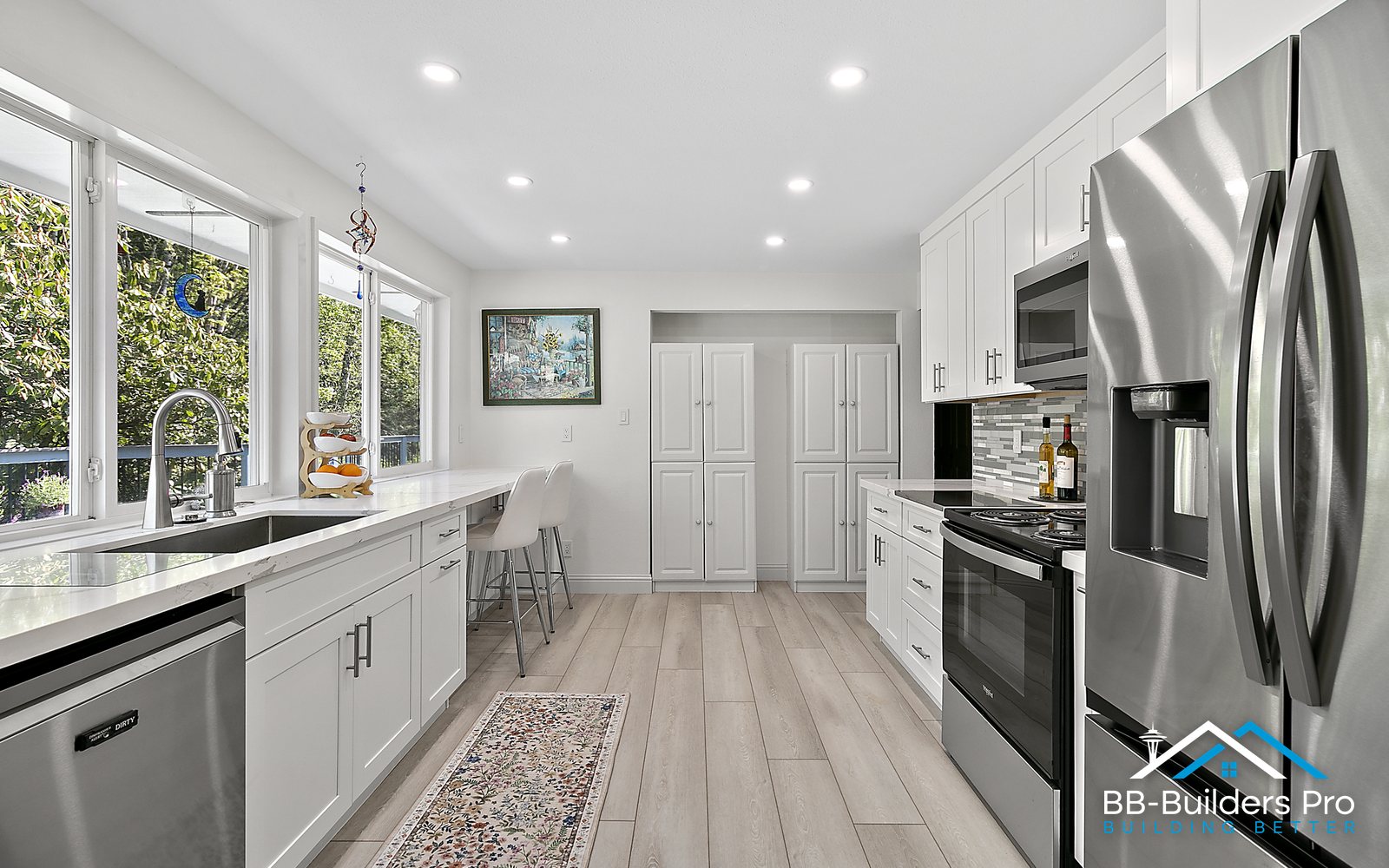 white shaker cabinets installed along a full kitchen wall during a kitchen remodel