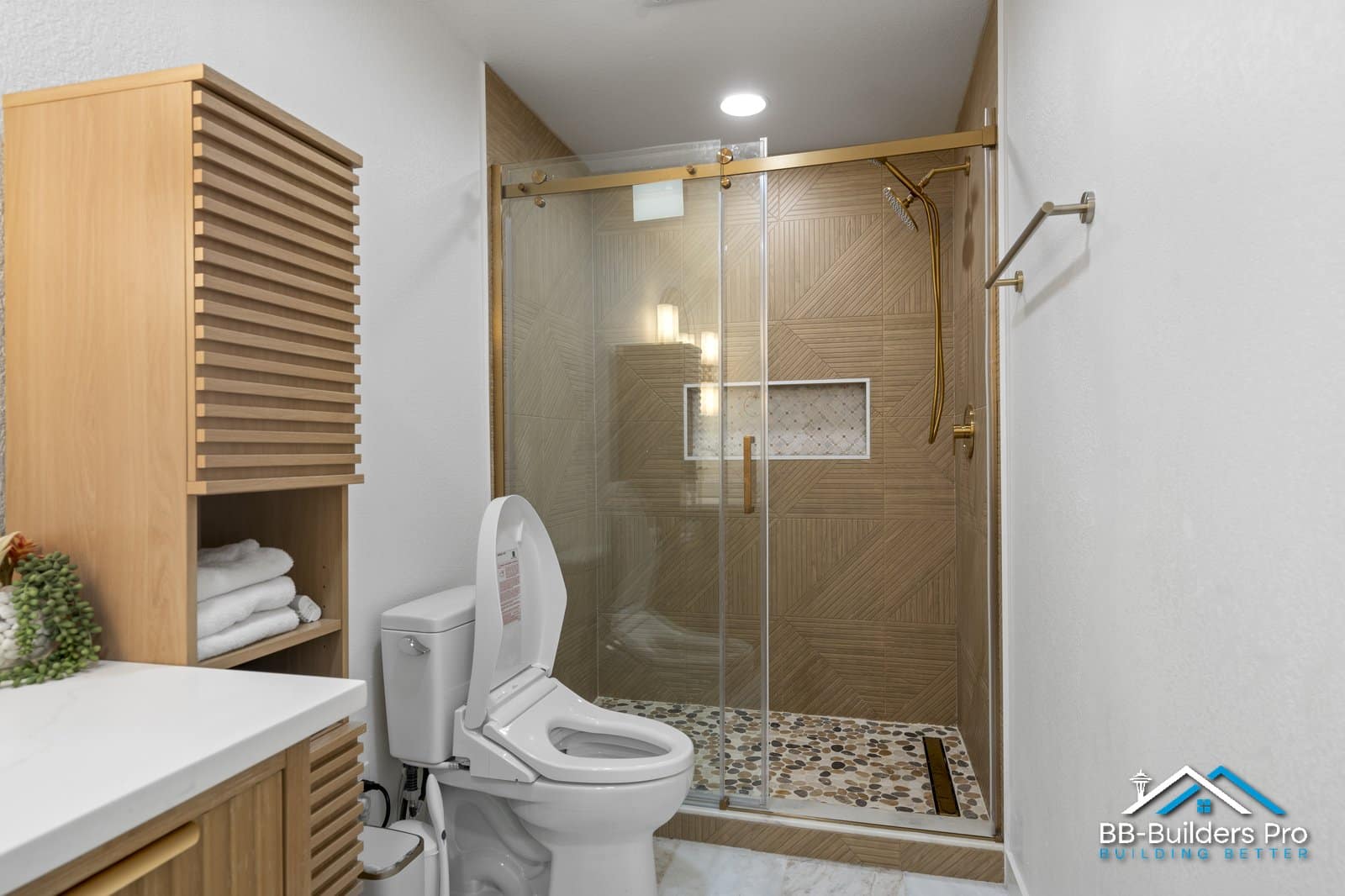 modern bathroom with grab bar mounted beside walk-in glass shower
